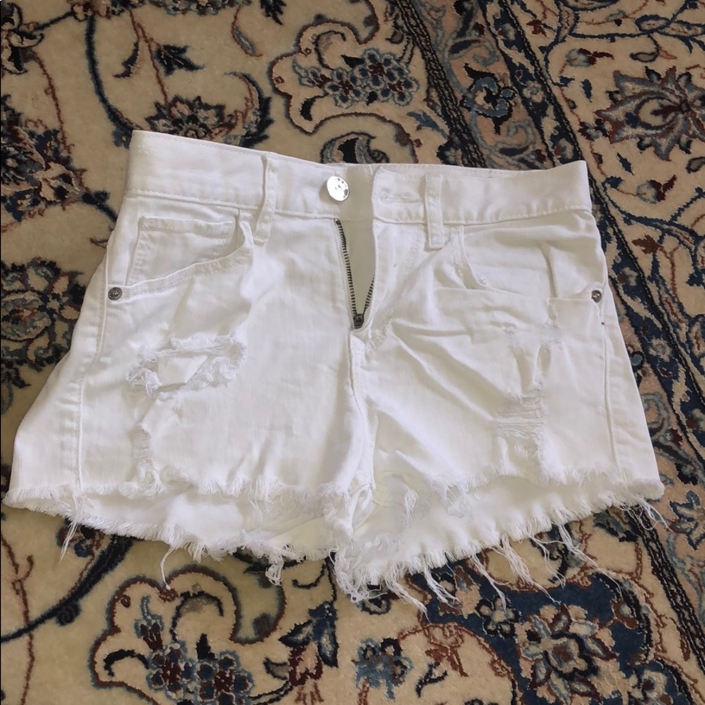 White ripped jean shorts